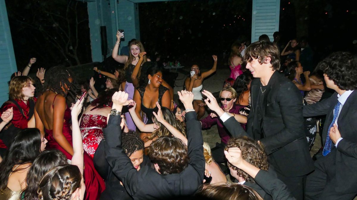 FOOTLOOSE AT LAST: Senior Asher Kay rocks out on the dance floor at the homecoming dance, put on by Student Council. Since the tradition of a homecoming dance fell out of practice after 2019 due to low attendance rates, this was Kay’s first time attending one in all of his four years. Kay felt that the mystery surrounding what the dance would be like added to his experience.

“As a senior it was fun to have at least one homecoming,” Kay said. “Since we had never had one before, and since I haven’t really been to any school dances, I didn’t know what to expect, but when I got there it was cool to see everyone having fun. Hopefully it was a success so they keep doing it and start a new sort of tradition at McCallum.”

Though his first and last homecoming dance has passed, Kay hopes the future classes will continue to put on the dance.

“I think they should keep doing it because it’s a good opportunity for people who may not be super social to talk to new people and have a fun experience outside of school,” Kay said. “But also, it’s good to keep [doing] it because it seemed to be a fun time for everyone.”

Kay enjoyed the dance floor and seeing his peers dressed up in HOCO finery, but noted his favorite part was the photo booth. 

“It was fun with my friends to get photos since it was the only HOCO we’ve been to, so we might as well have something to remember it by,” Kay said.

Caption by Lanie Sepehri.