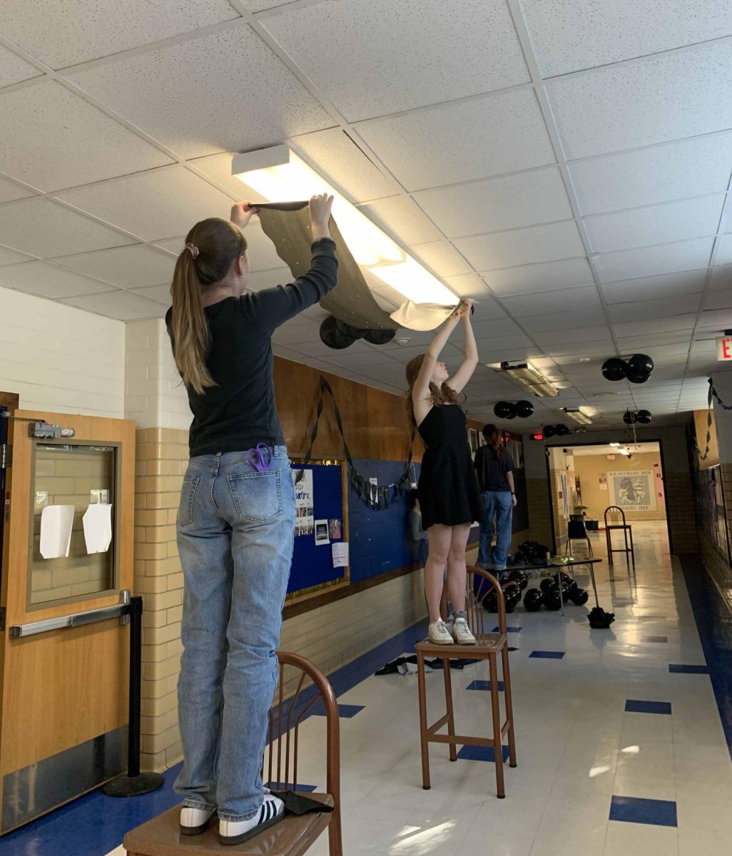 Juniors Poppy Harris, Ella Piston and the rest of student council worked hard over the weekend of Oct. 14-15 to deck out the junior hallway in black decorations for homecoming spirit week.