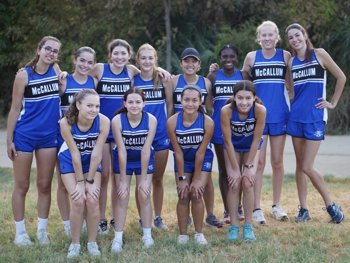 The girls cross country team poses for a picture before their 5k time trial at Town Lake on August 19.