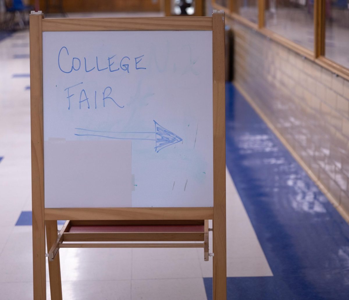 A sign advertises the annual college fair in the cafeteria on April 12. 