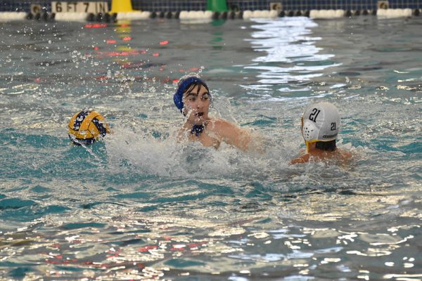 Senior water polo captain William Perkins plays in McCallum’s match against Anderson on Sept. 15 at the Round Rock ISD Aquatic Center. The Knights lost to the Trojans, 27-5.