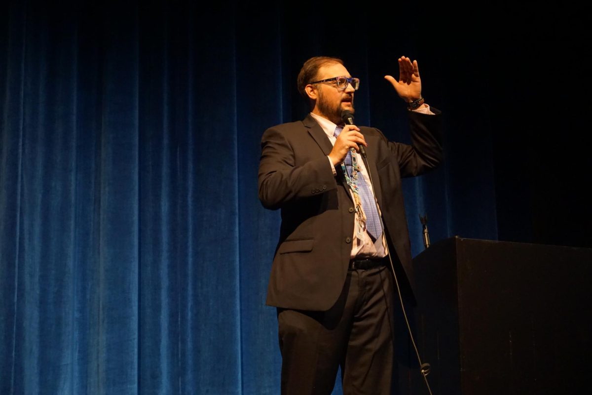 Fine Arts Director Samuel Parrott speaking during the Fine Arts Showcase. 