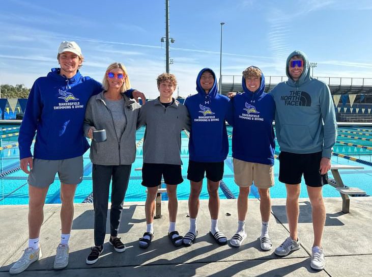 Senior Asa Rosenberg (third from right) poses with the coach and members of the California State University at Bakersfield diving team. One of the main reasons Rosenberg was attracted to the CSUB diving program was the culture of the team, which differed from his experience diving at UT.  When I got there I was like, Oh wow, these people are really connected and almost like a family, Rosenberg said. Thats something I really liked. Photo courtesy of Rosenberg.