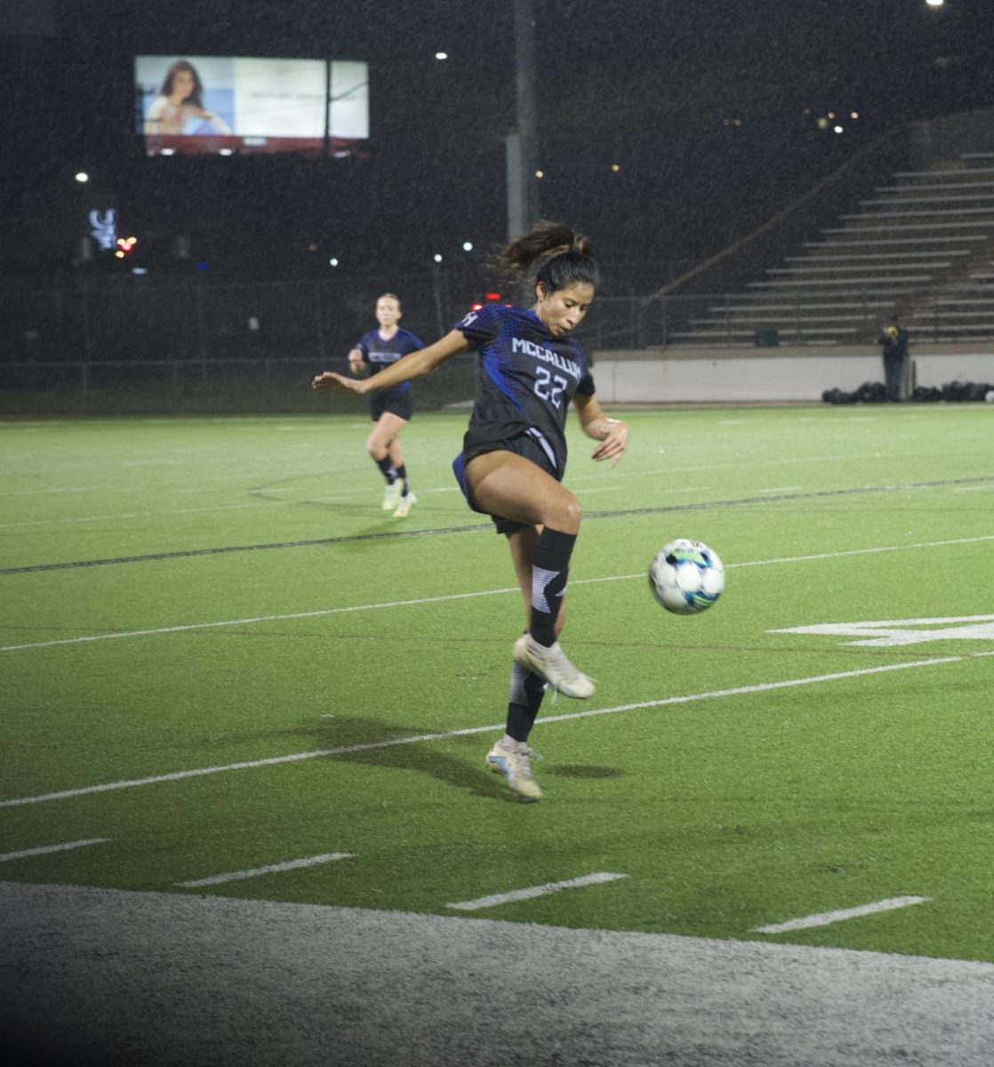 A SLIPPERY GAME: For junior Isaura Lopez, playing at House Park means an atmosphere of both excitement and nerves. For their first time playing there this season, the girls varsity soccer team met up with rivals LASA last Wednesday in the pouring rain. With full stands despite the downpours, the game had high stakes from the very beginning, which only fueled Lopez.

“I felt good going into the game,” she said, “I was nervous but I felt like I was prepared and ready to go.”

Though her confidence never faltered, the introduction of a new player to LASA’s squad caught Lopez off guard. With teammates telling her to watch out from the sides and the crowds jeering from above, she realized the competition was going to be harder than she anticipated.

“There was a fast player coming in on the field and I was told to be ready,” Lopez said. “I got a bit more nervous because I thought I wouldn’t be able to beat her, but I managed to.”

The rain didn’t help either, causing people to slip and the ball to change direction on a dime. This added level of difficulty only made McCallum’s need to communicate greater, something Lopez says the whole team could use some help with.

“We need to work on communication,” she said. “Being able to talk when we want the ball and control it more.”

Though the first match-up ended in a 1-1 tie, Lopez is confident in the team’s ability going into their next meeting.

“Our team played pretty well considering it was pouring rain,” she said, “We were playing a good team, and we still managed to play better [than them]. I know next time we will beat them.” 

Caption by Helen Martin. 