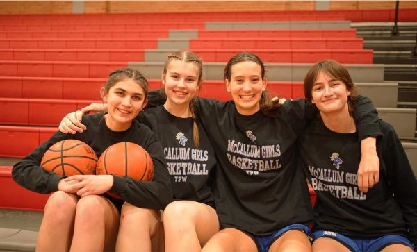 Senior captains Esme Barraz and Sam Shreves with their fellow senior starters Sam Cowles and Lily Hobbs. The quartet has played together since middle school and grown alongside the McCallum girls basketball program.