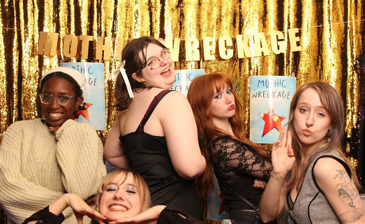 Nagle poses with friends at the Mothic Wreckage release party on Feb. 8. Photo courtesy of Nagle.