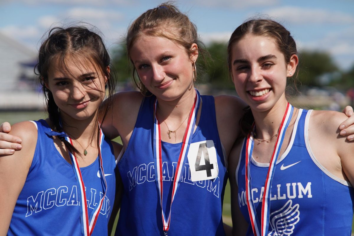 Senior Mika Hishida, junior Isley Cameron and sophomore Sara Hamlet pose together after placing at districts track prelims on April 11 when they were all a grade younger.