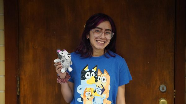 Senior Gaby Esquivel poses with her Bluey shirt along with her crocheted, Muffin stuffed animal.