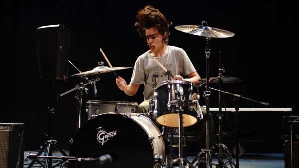 Senior King Perez-Cude playing drums at Battle at the Bands. Perez-Cude shared that the band performed well overall and that the audience’s reaction was the best payoff.

“My most memorable moment from that night was seeing everyone jumping off the stage and moshing,” he said. “It is always awesome seeing people enjoy our music in that way.”

Caption by Gaby Esquivel.