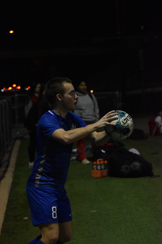 Senior Jay Schlett throws the ball back on the field for his team during their game against Eastside.