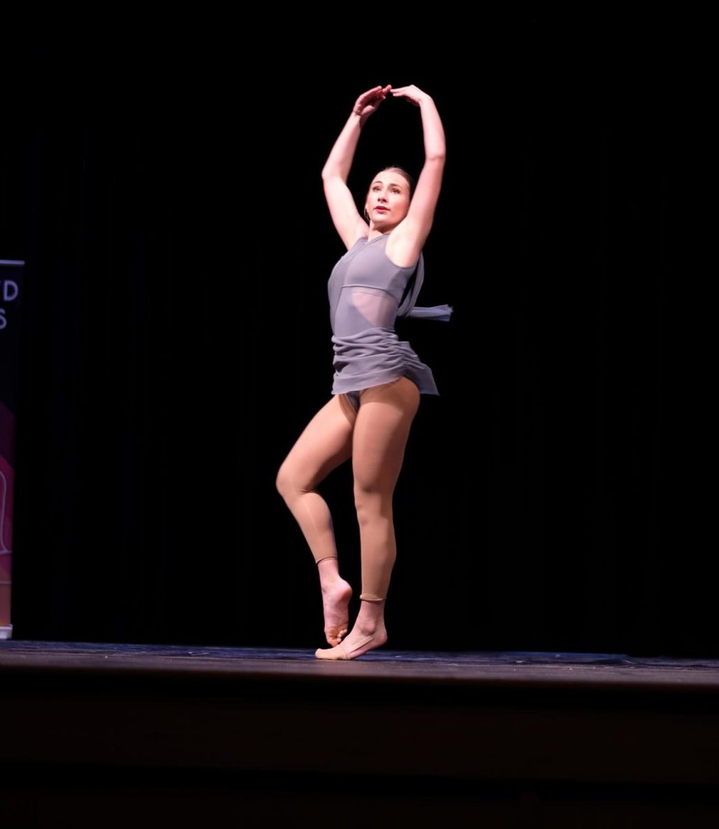 
 
LEARNING EXPERIENCE: Sophomore Paige Mitchell goes into a turn of her self-choreographed lyrical solo at Saturday’s Crowd Pleasers Dance Competition. Mitchell enjoyed the opportunity to design her own dance, though the process wasn’t without some difficulties. 

“I liked getting to create my own dance and be able to tweak and change things about it but it was challenging to create counts and specific timing in it,” Mitchell said. 

This year was Mitchell’s first opportunity to perform a solo at Blue Brigade’s contests. While on Saturday she didn’t receive any individual recognition, at the previous contest she was fourth runner-up in her category. 

“It definitely was a fun experience and I learned a lot from the whole process of choreographing and competing at the contests,” Mitchell said. 

Caption by Francie Wilhelm. Photo by Carson Duncan. 
