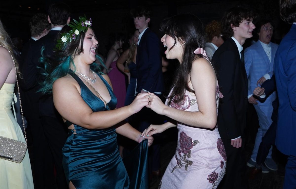 A YEAR EARLY TO PROM: Junior Sydney Devereaux dances with senior Chamila Munoz at prom. 

“Chamila is super sweet and one of my friends,” Devereaux said. “We went as a big group to prom, but this was one of the first times I had ever hung out with her, and we just really connected.” 

Munoz wasnt the only one Devereaux met during prom night. 

“I definitely met a lot of new people and talked to a lot of new people too,” Devereaux said.

But for Devereaux, prom, as fun as it was, was also a little nerve racking to attend as a junior.  

“It was definitely intimidating,” she said. “I thought I was going to be the only junior there, but I was relieved to see a lot of other juniors I knew.” 

Despite the nerves, Devereaux says she wont forget the dancing. 

“I’ve never really danced before, so it was definitely new,” Devereaux said. “And I definitely feel like I had to put myself out there and dance with my friends.”  

Caption by Naomi Di-Capua. 