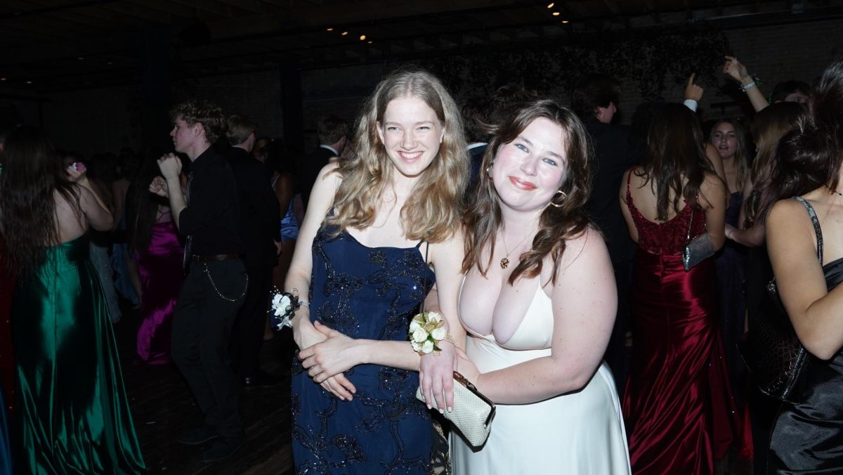 Ellie Loudermilk and Alice Scott posing at Prom. 
