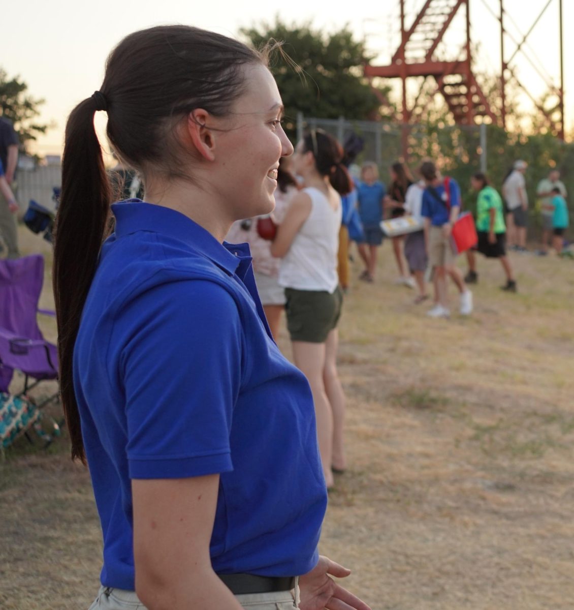 A GOOD START: Seniors Malena Linse chats with Ayden Lee about the band's performance of movements one and two at Bandapalooza last fall. Linse was impressed with what she saw.  “I think Bandapalooza went pretty well,” Linse said. “A first performance is definitely stressful, but it was exciting to show off the show.” Linse is one of three drum majors, which places her in charge of conducting shows, as well as assisting with general rehearsal procedures. Linse believes that to have a good season, Mac band needs to bring its A-game to every rehearsal. “Since football and competition season is quickly approaching, we are going to start putting more on the field soon,” Linse said. “So being focused will help it go smoothly.” Photo by Lucas Walker.