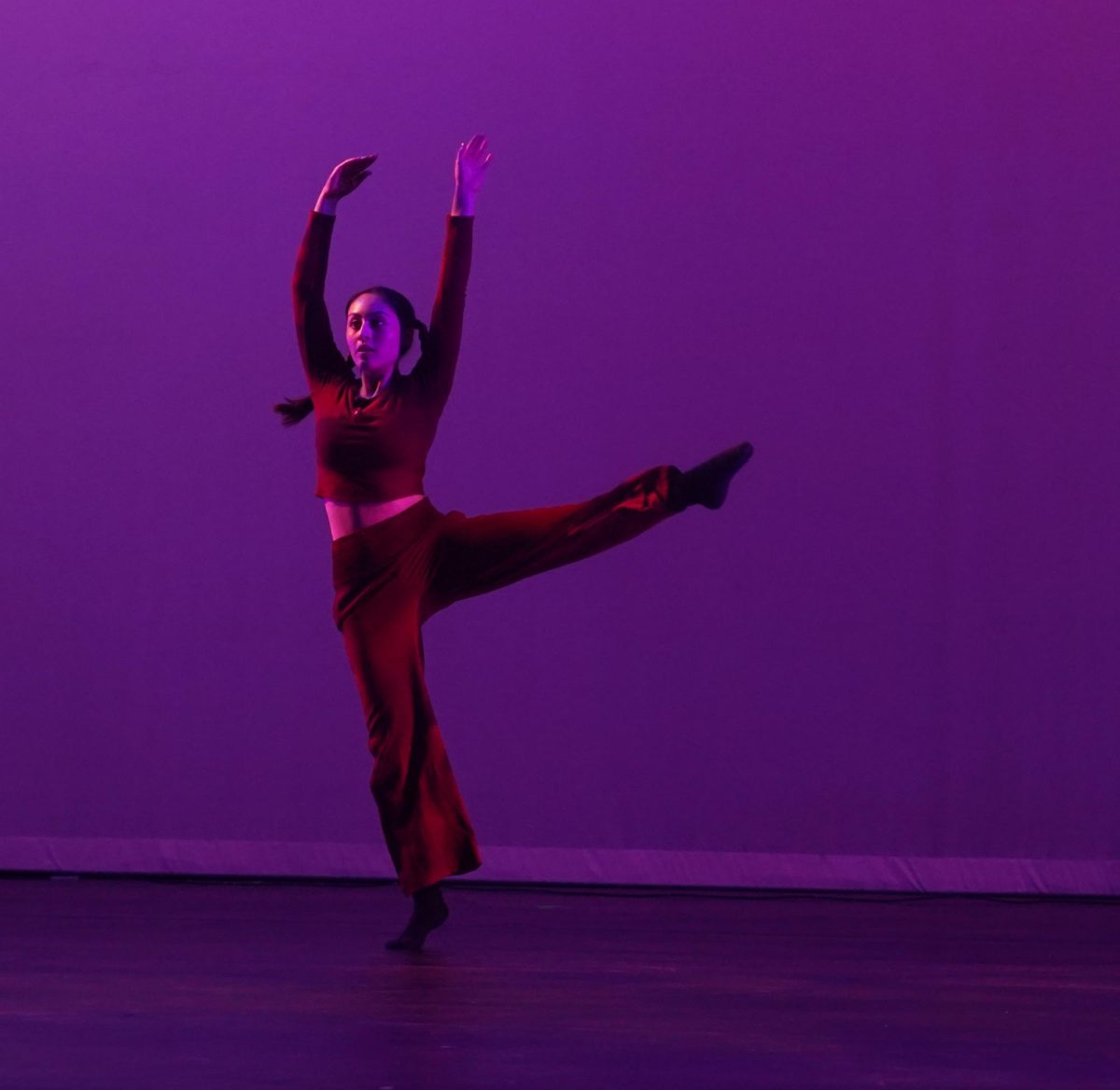 Senior dance major Ana Mejia performs her solo, "Cerando Este Capitulo," at the first performance of "Perennial," the student-directed dance show, on May 10 in the MAC. The performance stood out in part because it included live accompaniment provided by seniors Ellaiden Margrave and Sebastian Banks. Mejia also served as the business manager for the show. Her role in coordination with her other directors allowed her to incorporate ideas that she felt were important to the theme. 

“After one of the senior directors choreographed our class piece sophomore year, I began thinking about applying to be a director our senior year,” Mejia said. “My favorite parts of directing include applying what I learned in Mac dance over the years and working with a tight knit team.”

For Mejia, the experience was monumental since it marked her last moments with the dance program and she wanted to commemorate that. 

“After shadowing Tyler [Mankinen], last year’s business director, I felt prepared to take on the role,” Mejia said. “It was incredibly rewarding watching the final product of the many outside of school hours the student directors, dancers and technicians put into this show.”

The process for the six senior directors, however, wasn’t always streamlined and had moments where the team had to put their heads together. 

“It was very challenging choreographing three pieces, directing and dancing in two pieces,” Mejia said. “We worked together as a team and supported each other throughout the entire process.” 

The team was in charge, additionally, of setting up the timeline of the event, and rehearsals to improve on stage readiness. 

“I remember at the beginning of January we all agreed to start planning early so that we could give choreographers more time to think about their pieces,” Mejia said. “We wanted to have the choreographers follow the theme more closely so that they would have a more cohesive feel.” Caption by Chloe Lewcock. 