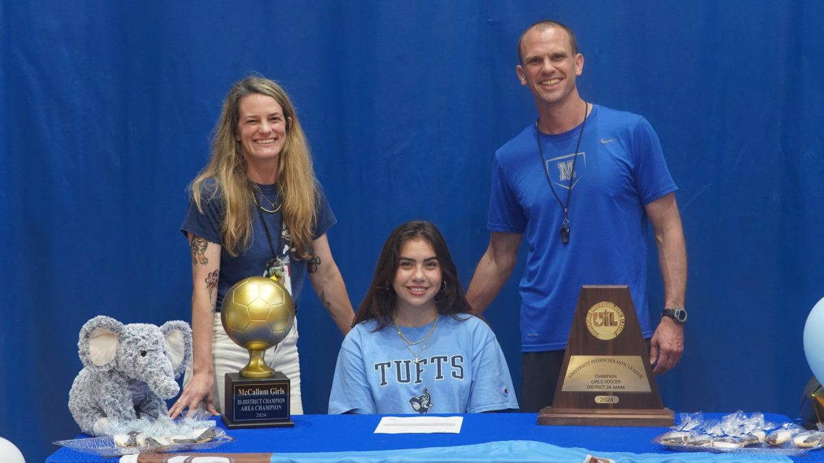 Senior varsity soccer player Sarah Hauck, shown here with her soccer coaches Cat ONeal and Thomas Gammerdinger, celebrated her signing day on May 16. In a field house ceremony before her teammates, coaches and supporters in the field house, she officially committed to Tufts University where she’ll pursue both her soccer career and her academic aspirations.

Hack’s decision to join Tufts was influenced by various factors, but she was inspired by the family legacy associated with the institution.

“Tufts is an exceptional college with a vibrant social scene, and the fact that my dad and grandparents attended only adds to its appeal,” Hauck said. “It’s also a highly respected college along the East Coast, making it an ideal fit for me overall.”

Athletic director Coach Thomas Gammerdinger, who assumed the girls varsity soccer head coaching duties midway through the season, commended her qualities as a player and as a person.

“Sarah possesses all the essential traits you look for in a top player — aggression, technique, and stepping up when it matters most,” Coach G said. “I’m genuinely thrilled for her; this achievement is the culmination of her relentless hard work and dedication. I’m extremely happy for her and witnessing someone achieve their long-held goals is also rewarding.”

Caption by Tristen Diaz.