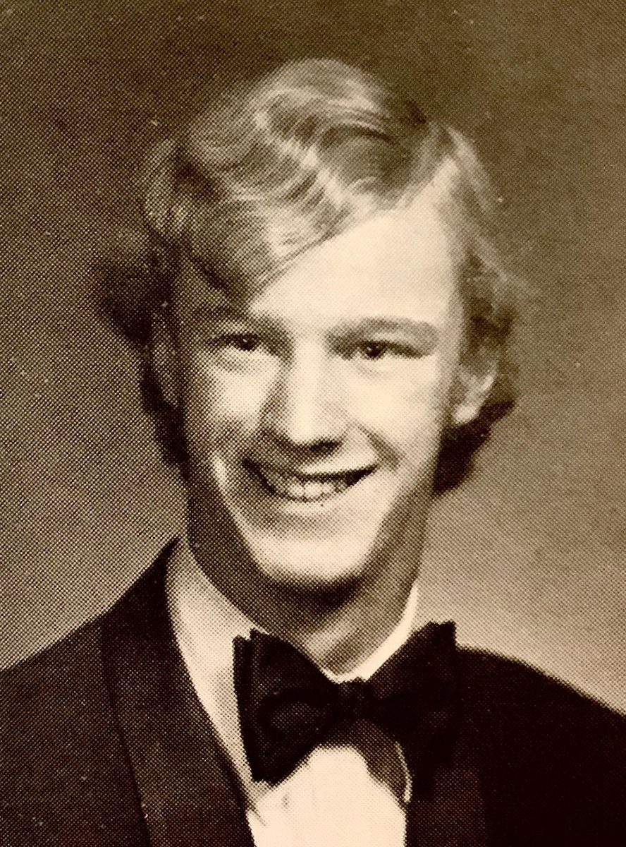 This is Paul Pews high school graduation photo. The 2023-2024 school year marked his 34th year of teaching. He began his career in Washington, then came to McCallum where he has taught for the past 17. At heart though, he’s really a musician. One that grew up in many different places, including Chicago and California, who took interest in teaching from a young age. His high school choir experience, along with some international singing in college, persuaded him that teaching was his path. He knew he wanted to be able to help create works of art in the fine arts department as well, so he joined McCallum. He’s worked on many of the musicals over the years, even before Joshua Denning, the former theatre director of the fine arts program arrived. Before him was a different director: Tatum. 
“I was the music director for all the musicals,” Pew said. “[Mr. Tatum and I] worked very hard, and I just got to the point where I was satisfied with it.” Although he may not be as prominent of a member in the musical theatre community at McCallum anymore, he still plays piano. “I still do a lot of music down at the Music end of the building,” Pew said. Photo courtesy of Paul Pew.