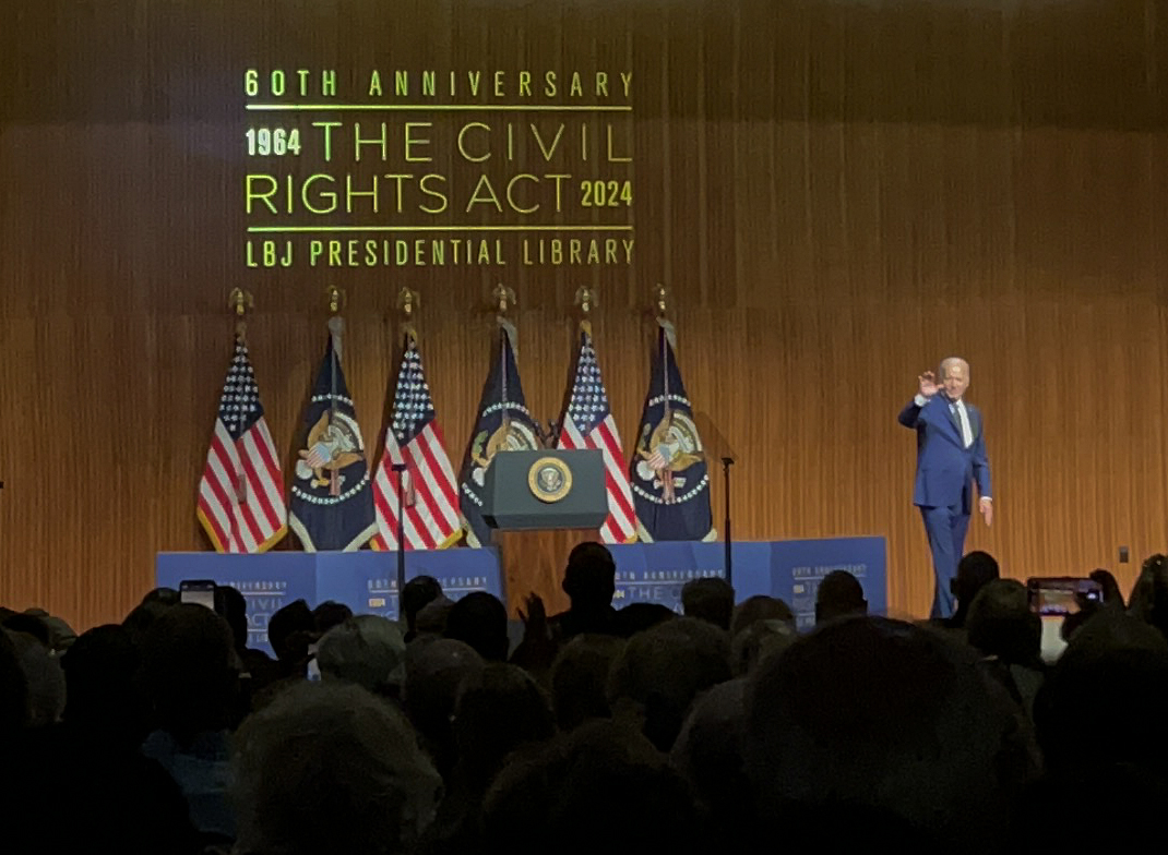 Beyond commemorating the 1964 Civil Rights Act, Biden directed much of his speech to looking forward. He spoke about the importance of understanding that past accomplishments are not the stopping point but rather the foundation from which to keep building.

“President Johnson signed the Civil Rights Act of 1964 just two days before the Fourth of July,” Biden said. “He said in that bill signing, and I quote, ‘This is a proud triumph. Yet those who founded our country knew that freedom would be secure only if each generation fought to renew and enlarge its meaning.’”

Biden called for a constitutional amendment that would prohibit immunity for crimes a former president committed while in office.

“I share our founders’ belief that a president must answer to the law and the president is accountable in the exercise of the great power of the presidency,” he said. “We’re a nation of laws, not kings and dictators.”

He also focused his attention on flawed aspects of the Supreme Court, which just granted presidential immunity in Trump v. The United States earlier this summer. Biden stated that term limits and a mandatory code of ethics would create a more balanced power over time. He said that these reforms are needed “to restore trust in the courts and preserve the system of checks and balances that are vital to our democracy.”

During his remarks Biden talked directly about his decision to step aside from the 2024 presidential election, as President Johnson did in 1968. Following this decision, Biden endorsed Vice President Harris’ campaign for President and spoke on her ability to continue the work.

“She has been an incredible partner to me, a champion of civil rights throughout her career, and she’ll continue to be an inspiring leader and project this very idea of America: the very idea that we’re all created equal and deserve to be treated equally throughout our lives,” he said. “We’ve never fully lived up to that, but we’ve never walked away from it.” Caption by Lillian Gray.