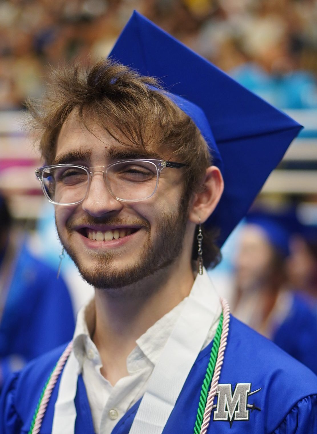 Cypher Rosonnette smiles as they joins their classmates during the processional at  the Class of 2024 commencement ceremony at the Burger Center on May 30.