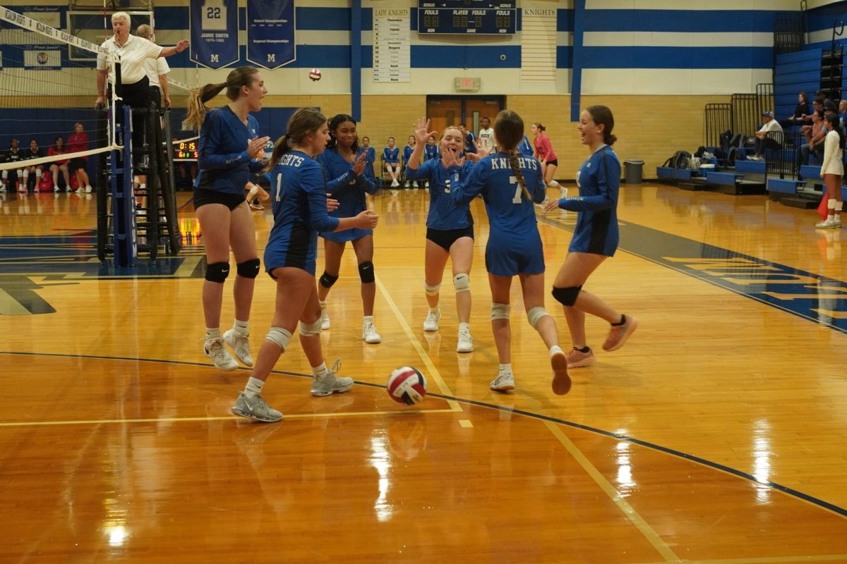 The freshman A players who were on the court celebrate the last point of the Knights victory over Connally to start the Knight Freshman Tournament. After winning the first set, the Knights fell behind by 11 points in the second set before roaring back to complete the sweep of the Cougars. The Knights would go on to run the table defeating Manor Tech, St. Andrew's, LASA and Bowie to win the freshman tournament that McCallum Volleyball hosts for the first time ever.