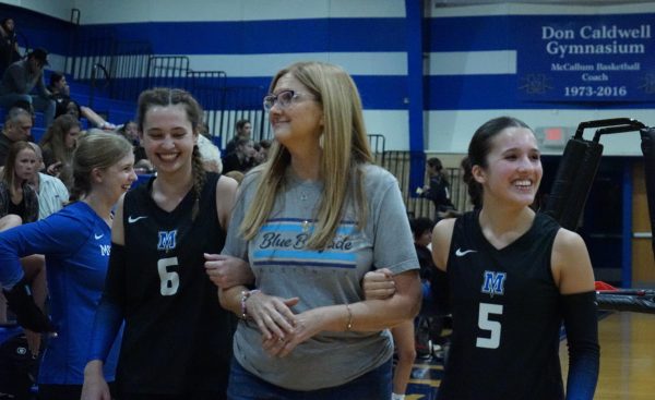 APPRECIATING TRADITION: For senior Kai Talebi’s last teacher appreciation volleyball game on Friday night, she stuck with tradition, and chose to ask English teacher Amy Smith to walk the court with her before the game.

“I took her last year too, so it’s kind of like tradition,” Talebi said. “Now I was like, ‘Of course I have to take her.’”

Talebi is happy to have had Smith twice in the past four years, first for her sophomore year and again this year. Noting that Smith was an integral part of her high school experience, Talebi said the English teacher had a very positive impact on her.

“Senior year, it’s been really fun to have her as a teacher again because I already know her super well, and we have a good relationship,” Talebi said.

Having a teacher twice is not very common, but for Talebi, it was a blessing in disguise.

“Sophomore year she definitely helped me get out of my shell a lot, and encouraged me a lot throughout the year,” Talebi said.

The pair have been close ever since the first class Talebi had with Smith, Advanced English 2. Talebi is also a tutor in the Writing Center, so they see each other very often.

“She [Smith] is the sweetest,” Talebi said. “And we have definitely grown closer because of me being her student multiple times.”

Caption by Priya Thoppil