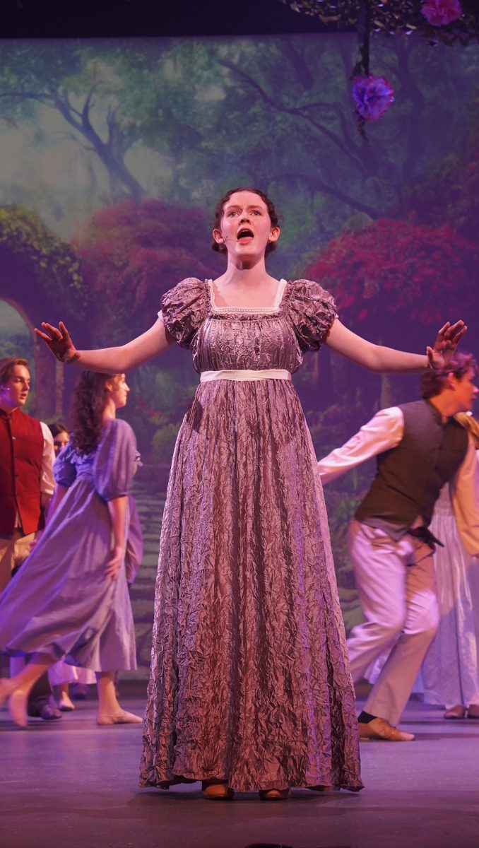 Sophomore Fiona Kirsch, who plays Mae Tuck, performs the song, "Your Most Beautiful Day" at the opening of Tuck Everlasting. 