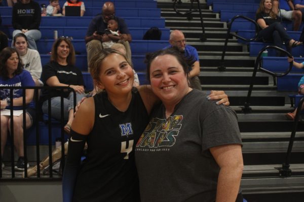 Noack poses with varsity volleyball player and junior Isa Urbina, who honored Noack on Teacher Appreciation Knight. Photo by Mercury Estabrook.