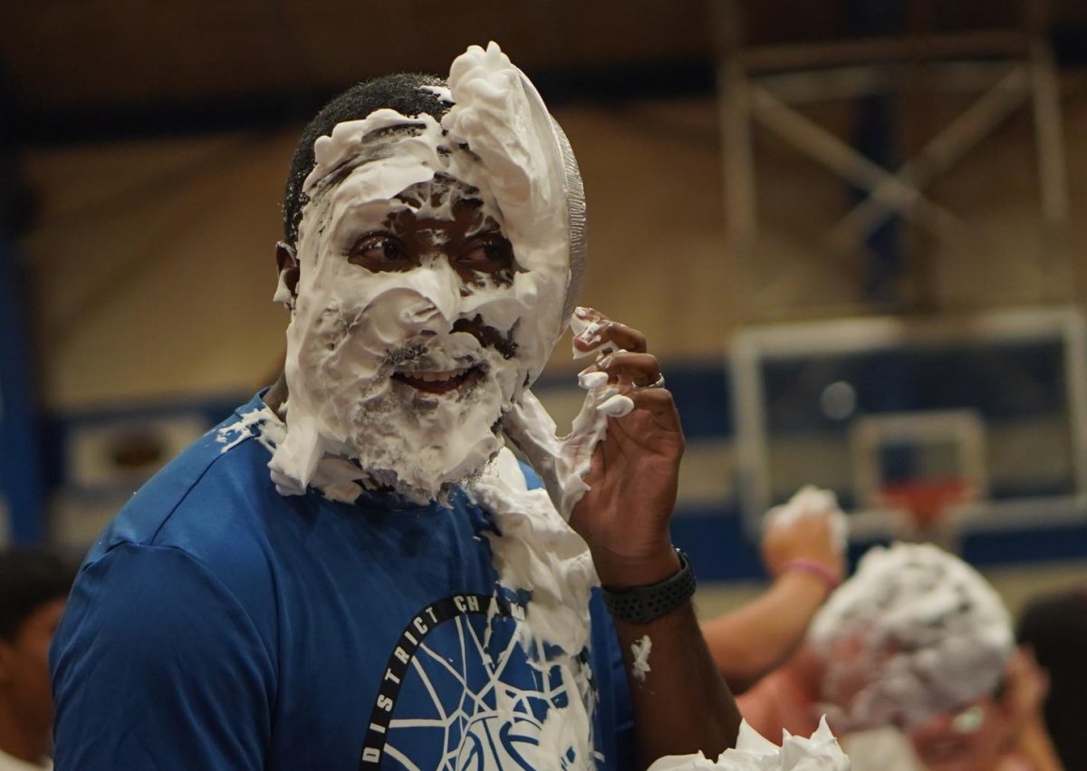 A PINK WEEK FACIAL: Basketball coach Carlin Shaw had nowhere to run and nowhere to hide as his basketball players who are also in PALS are numerous, and, as this photo attests, very accurate shooters.

Math teacher Kelly Wroblewski was also one of the teachers who was selected by students to get pied. 

"Two of my students are PALS and they asked if they could pie me in the face," Wroblewski said. "They were like please, please, please, so I was finally like OK." 

Wroblewski said she was also able to get her son involved in the pieing alongside her. 

"I went home and told him, and he immediately said he wanted to get pied in the face as well," Wroblewski.

Caption by Josie Mullan. 