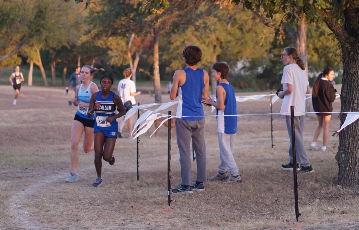 Junior Julia Lentz races the five-kilometer course at the UIL District 24-5A Championship, Oct. 11.