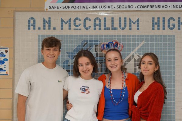 Dressed up for USA Day, senior StuCo members Evan Bausman, Kalliope Haltom, Poppy Harris and Christina Petropoulos pose near the office where they present the morning news to Mac. Photo by Eva Sanchez.