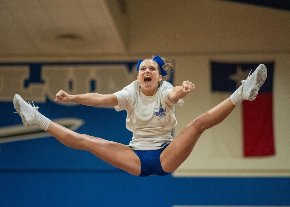 Senior Avi Zeifman flies during Taco Shack pep rally on Aug. 29.