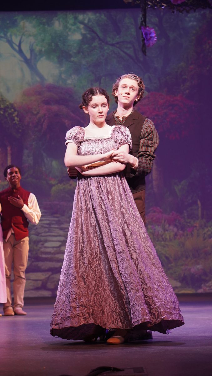 Sophomore Fiona Kirsch dances with sophomore Joseph Blackwood in the song, “My Most Beautiful Day” during the opening performance of Tuck Everlasting. Kirsch describes her character as a loving mother and wife with a heart of gold. 

“Mae Tuck is very loving and protective,” Kirsch said. “She’s had like, 130 plus years, so she’s had a lot of life experience. I think at this point in time, she’s kind of down because she hasn’t been getting a lot of attention, but she just has a lot of love in her heart.”

