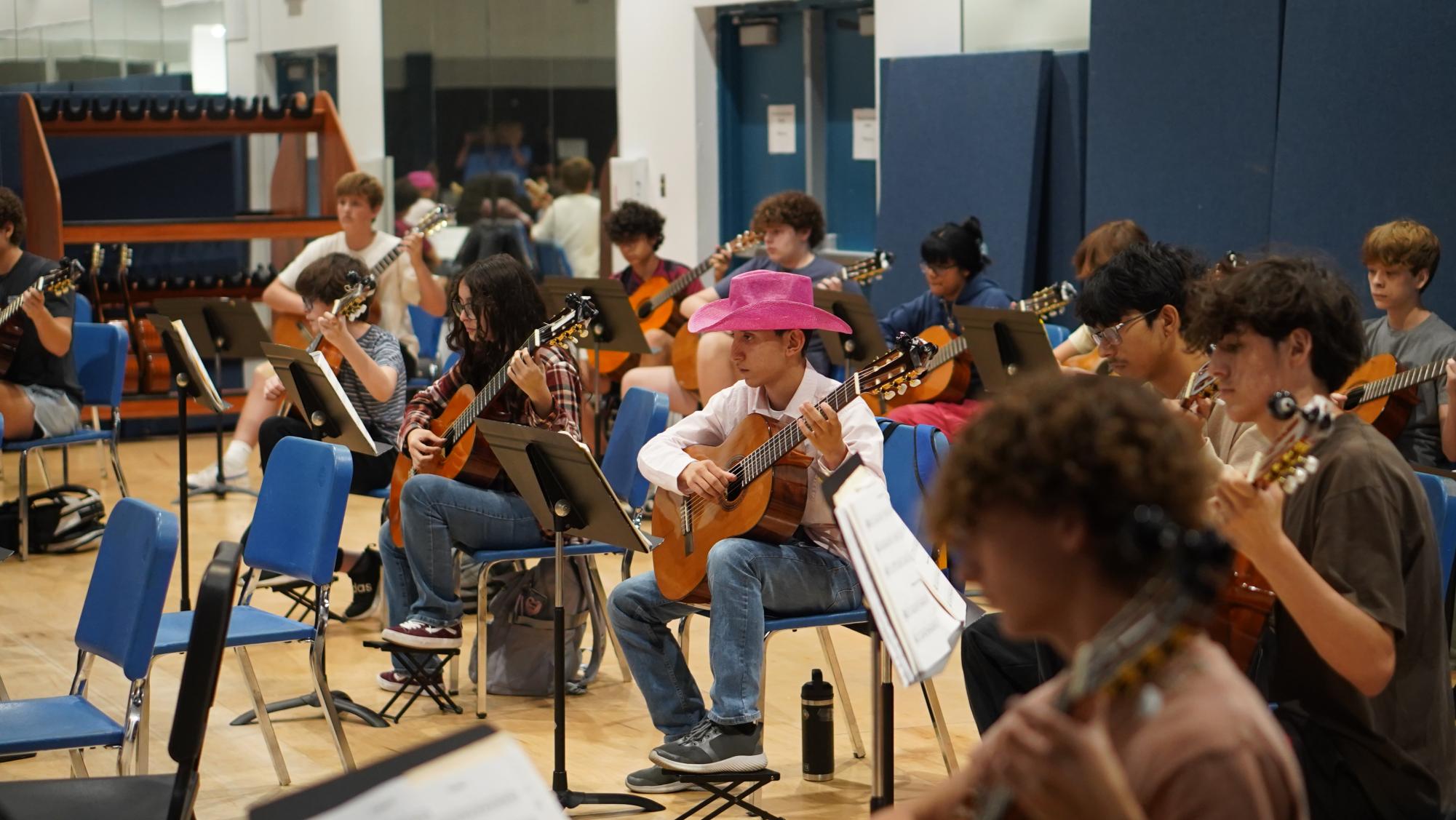 Sixth-period guitar class practices in its new studio in the Black Box Theater on Oct. 10. 