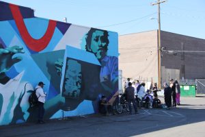 People gather outside of the Dayton Street Day Labor Center in Aurora, Colorado, to get food and necessities. This center is vital to many newcomers, helping them find work and support.