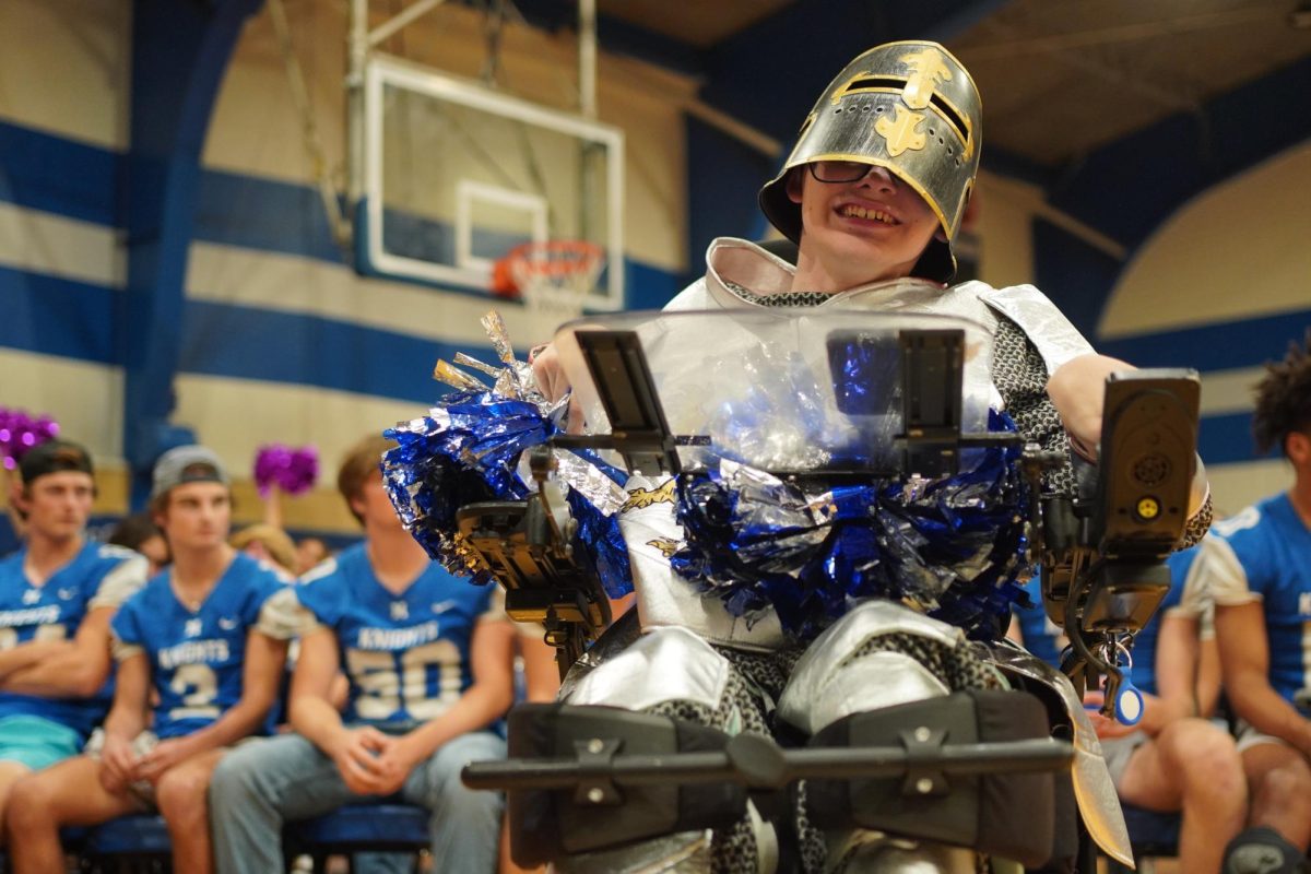 KNIGHT IN SHINING ARMOR: Senior Ben Polega drives school spirit during the homecoming pep rally. Polega has been dressing up as a knight for pep rallies and games for two years now. He says that as his final year as a high schooler is coming to an end, it has become an emotional time reflecting on his years here as a student. 

One fond memory he has is from his English class junior year. In his class were two football players who recognized him for supporting them in their games. At the end of the year they wrote ‘BEST MASCOT EVER’ in his yearbook.

“I believe it is important to show school spirit but not be downright nasty,” Polega said.

Caption by Zev Zent.
