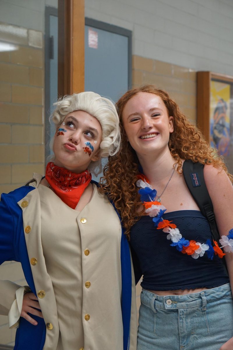 THE SPIRIT OF A SENIOR:
Seniors Mallory Beckham and Julia Rasp show their school spirit for USA Day during homecoming spirit week. The last year of high school is bittersweet for many students, but spirit days give seniors the chance to go out with a bang.

“It’s senior year, and it’s our last chance to show school spirit,” Beckham said.

Beckham wanted to make the most of her final year at McCallum, enthusiastically embracing each day’s theme and activities. Taking part in all of the spirit days and painting her face in blue and silver for the big game, Beckham showed her dedication to school pride. 

“We’re here to show pride for McCallum and show that we care about our school,” Beckham said.

Caption by August Gleason.
