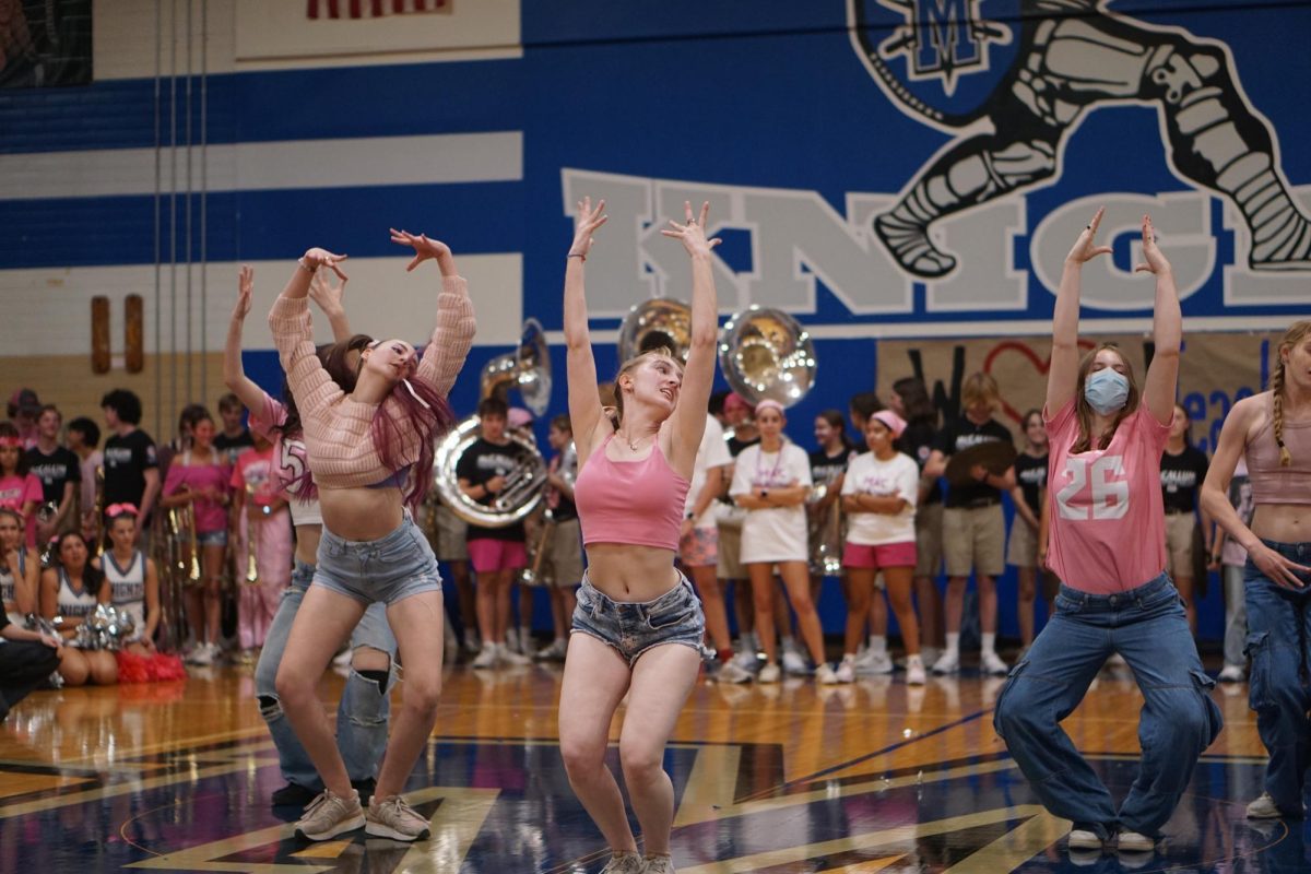 Junior Ollie Roberts, sophomore Kate Griesemer, and freshman Ione Bryton pose during their pink week performance on October 10th, 2024.