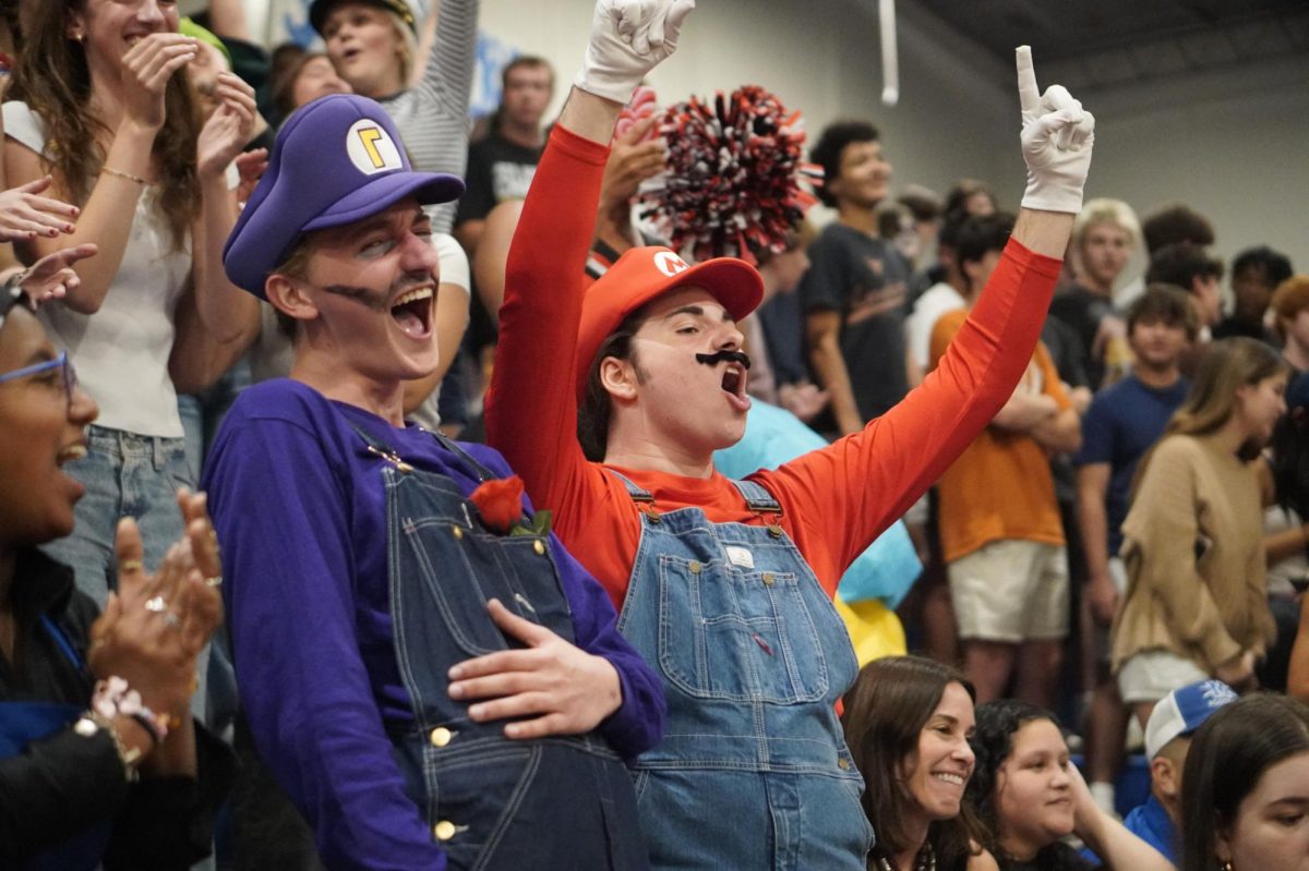 ONE LAST BATTLE CRY:
Seniors Joe Colaleo and Theo Northcutt dressed as Mario and Waluigi cheer hard as they win their last senior battle cry. 

“I was very excited and happy because we had just won,” Colaleo said. “Now that I look back on it, it feels a little sad knowing I can’t go to another one.”

Colaleo said although the moment was bittersweet, it’s also nice to know other things in life are coming up.

Colaleo and his two friends said they dressed as Mario characters because it was a simple and fun costume idea. 

“I decided on the costume because it’s so iconic and recognizable,” Colaleo said. 

Caption by Josie Linton.