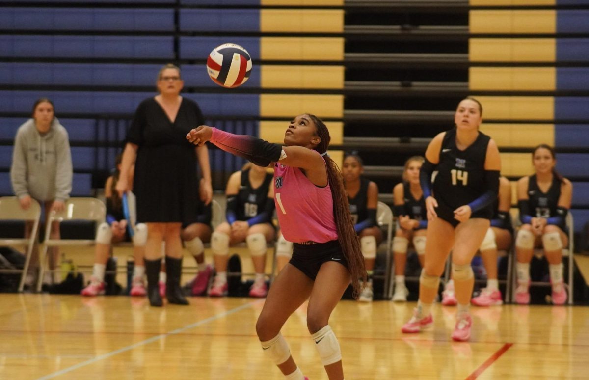 Junior Aanyia Thornton passes the ball during the Knights varsity playoff game against Hendrickson.