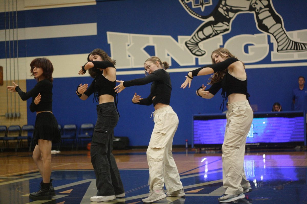 Blu3 performs during halftime at the varsity boys basketball game against Hays on November 12th, 2024.