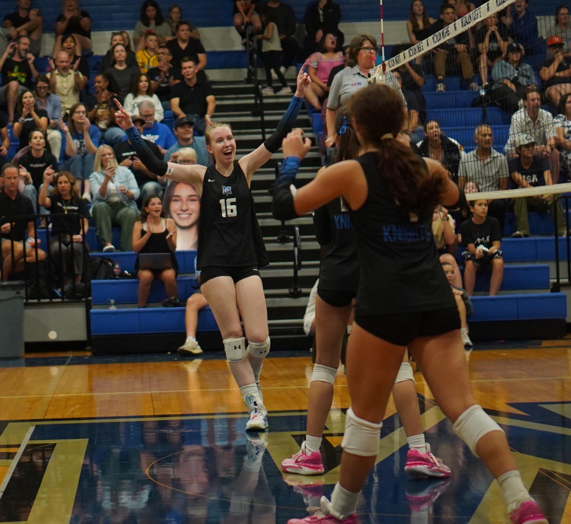 Senior captain Greta Carlson celebrates point with her team after scoring a kill against the LASA Raptors on Oct. 11. 