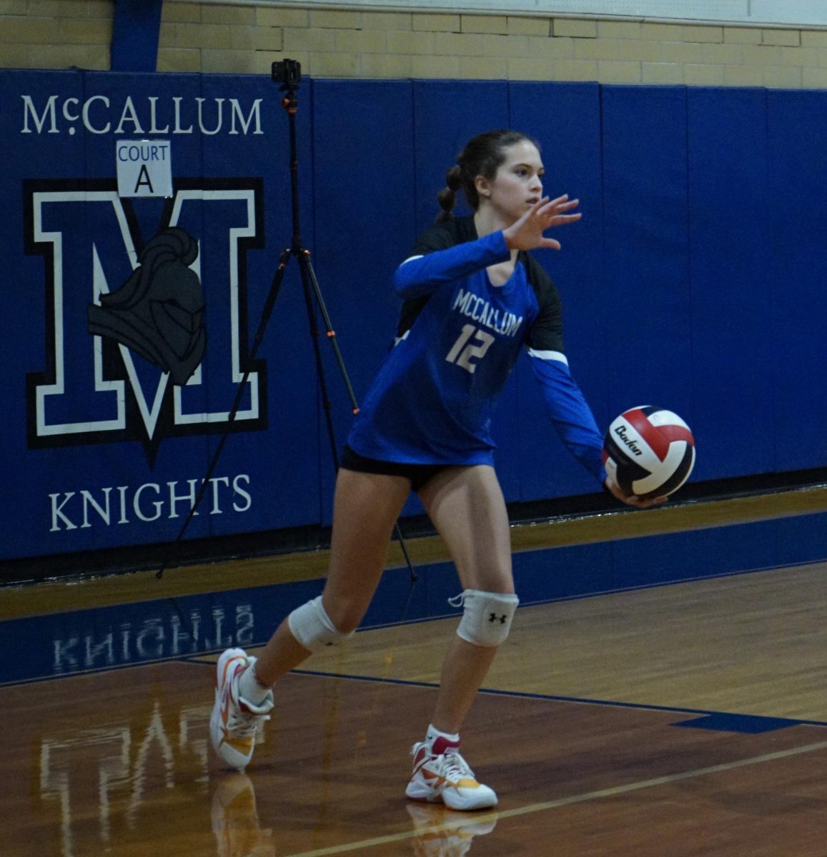 Freshman Piper Adair serves during the Knights' 3-0 victory over Eastside on Sept. 6. Adair had an ace during the match, the Knights won six points on her serve. More impressively perhaps, Adair had her season-best and career-high in kills in the match with 14 on 26 attempts.