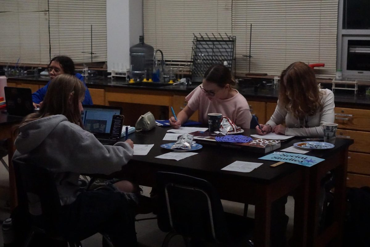 Freshmen students focused on studying for their finals while they snack on Christmas treats