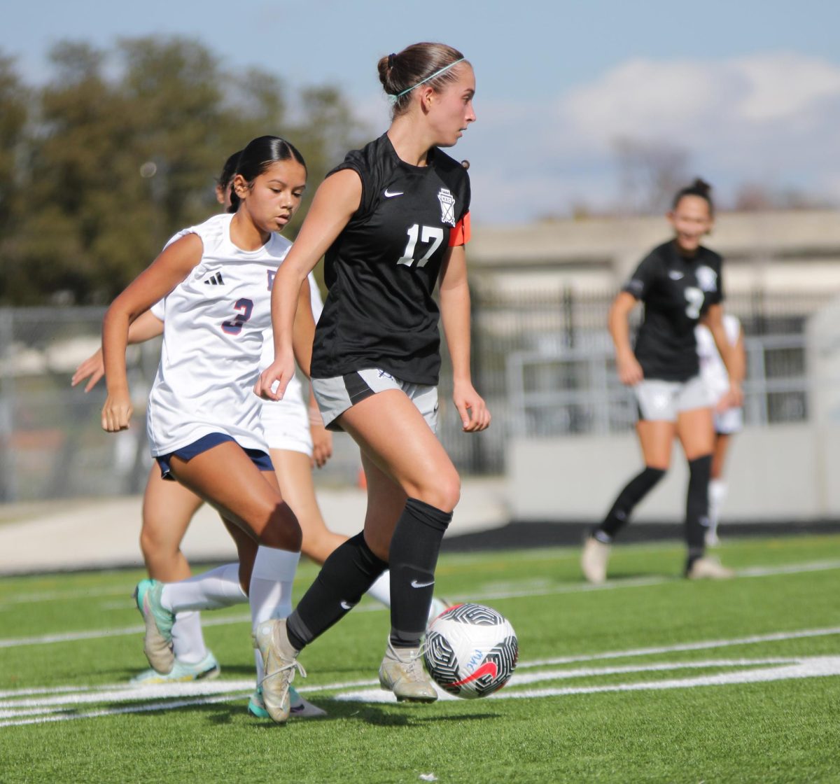 Senior captain Ashley Mankinen pushes the ball upfield during the Knights' 3-0 scrimmage victory over East View at Burger Stadium on Dec. 14. 