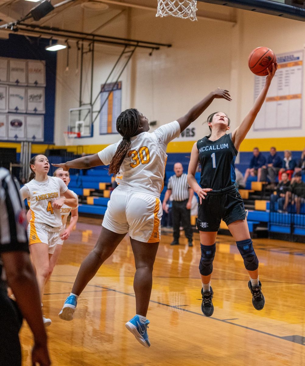 Senior Emy Chen gets off a layoff attempt during the Knights' district loss at Anderson on New Year's Eve. 