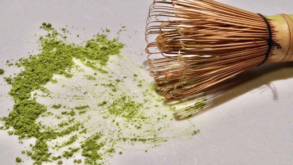 Traditional matcha whisk (Chasen) and matcha powder. 