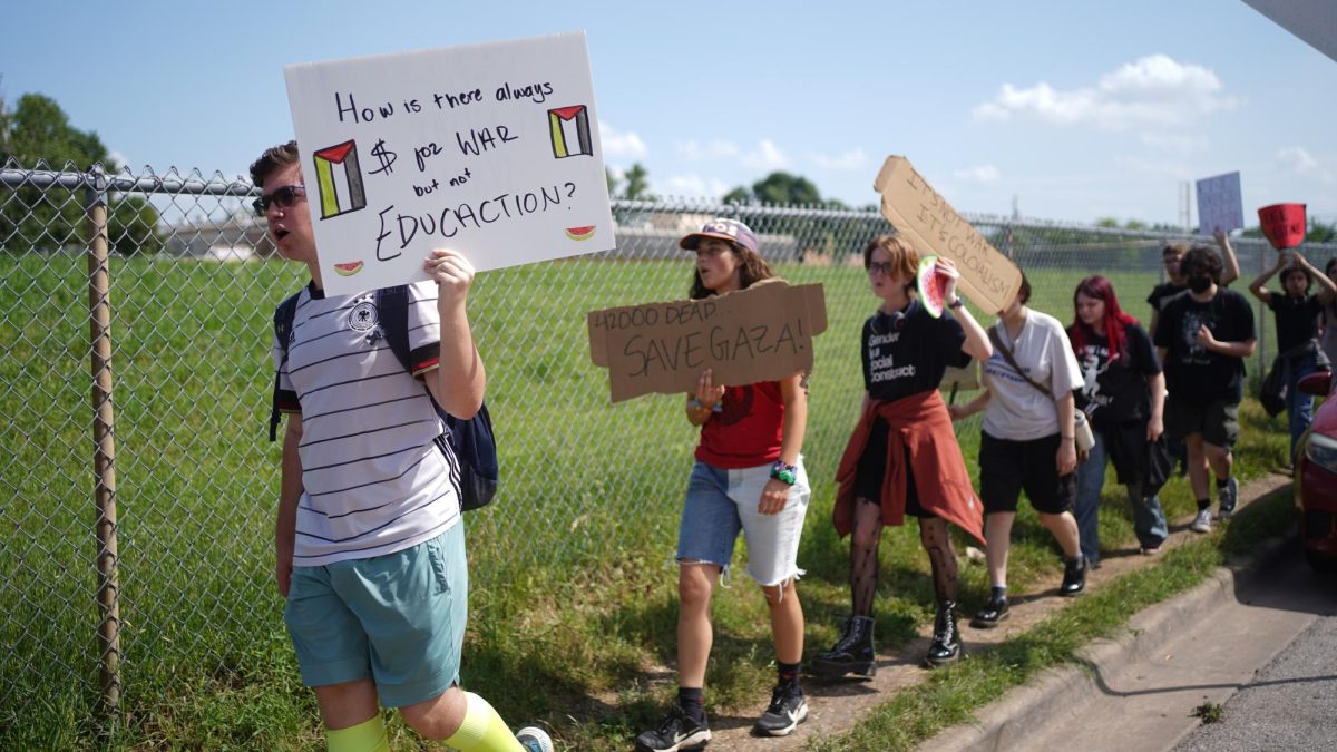 Between 50 and 100 students walked out of their fourth period classes to voice their support of a cease fire in Gaze and to express solidarity with the collegiate protestors for Palestine at the University of Texas and at universities across the nation. The walkout was part of a coordinated protest at Mac, Ann Richards and LASA. Caption by Nate Williams.