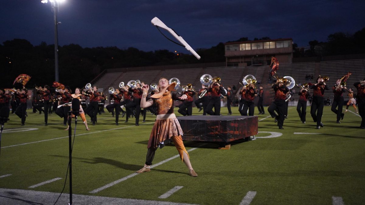 Junior Lark Thompson performs with color guard during halftime at Bastrop on Sept. 17. 