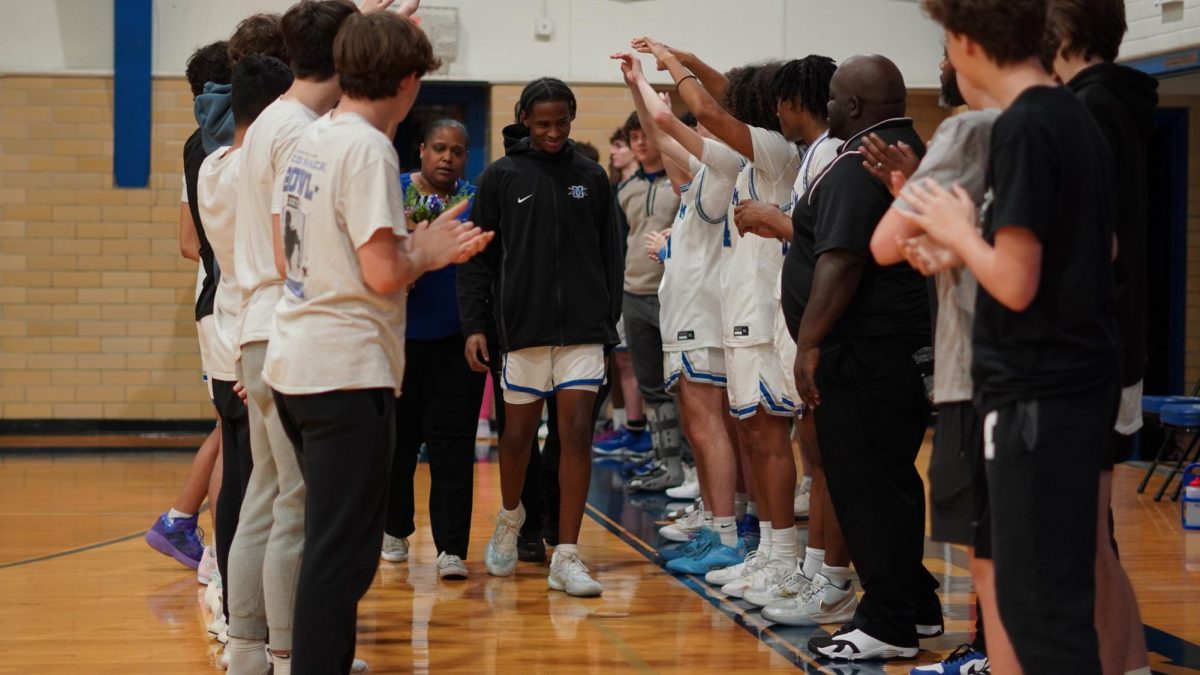 THE FINAL SHOT: For senior Jaiden Booe Senior Knight was the single best moment of the entire district season. After nearly finishing undefeated the win against LASA, and the secured spot in the first round of UIL playoffs summed up Booe’s love for basketball all in one game. 

“[My favorite thing about playing] is making memories with the team because we are all about to graduate,” Booe said. “Just playing, having fun with the guys knowing it's the last home game at McCallum.” 

For Booe the pre-game ritual to the teams' basketball games was another highlight during his years on the team. 

“My favorite thing about playing is the pre-game shooting with my teammates in the back gym,” Booe said. “We practiced hard and made sure to have fun.” 

For Booe basketball ends in high school, however he plans on continuing his athletic endeavors at Kilgore College for football. 

Caption by Chloe Lewcock. Photo by Julia Copas
