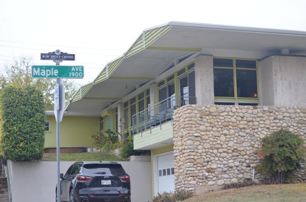 FEATURES: This home is one of the more famous homes designed by John Saunders Chase, the first licensed African American architect in Texas. According to the National Organization of Minority Architects, or NOMA, website, he was also the first African-American student to enroll at a major predominantly white university in the South.  The house is a widely known architectural landmark. “His houses are a staple point in the neighborhoods history” a representative for the E4 youth tour said. The historic district sign can also be seen proudly displayed above the street signs, indicating the historic nature of the original homes in the neighborhood. Caption by Avital Cuevas.